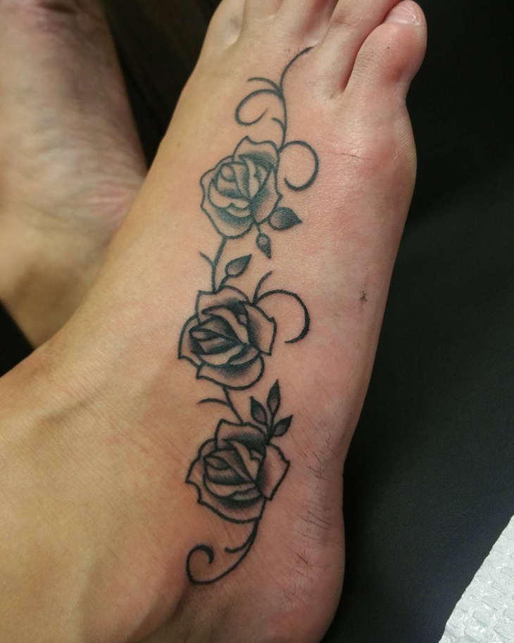 flower vine tattoo design on foot