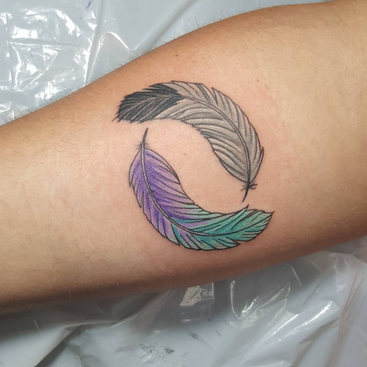 eagle feather tattoo on hand