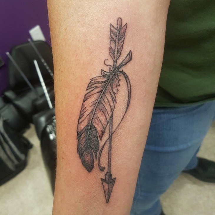 eagle feather with arrow tattoo