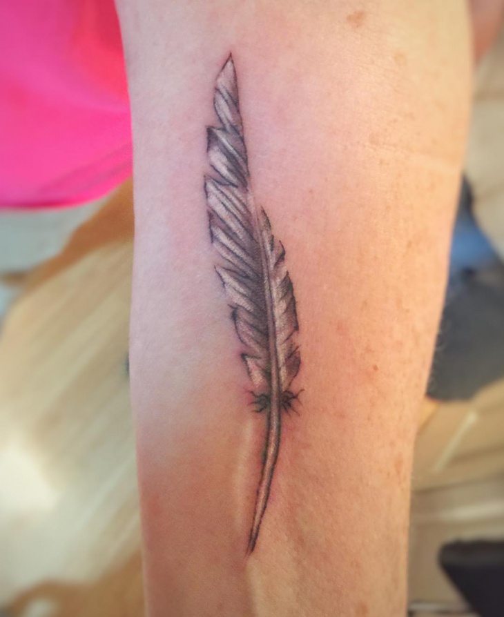 simple white feather tattoo