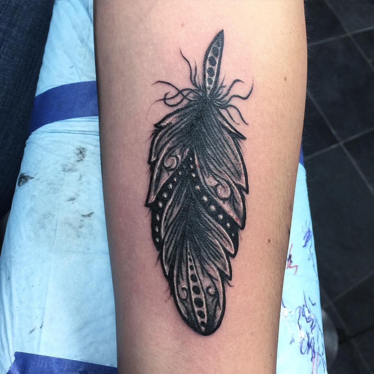 black and gray tribal feather tattoo