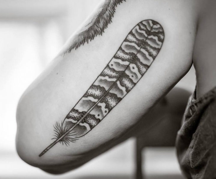 black owl feather tattoo