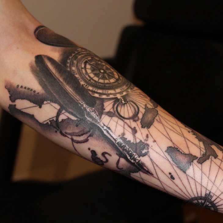 compass feather arm tattoo