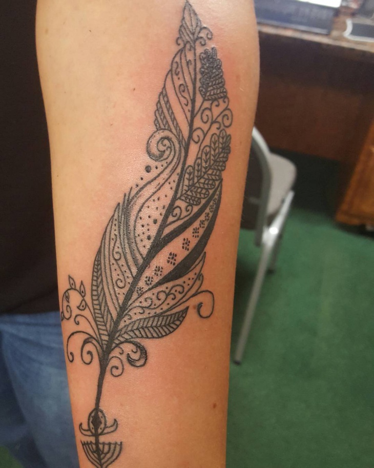 paisley feather tattoo on hand