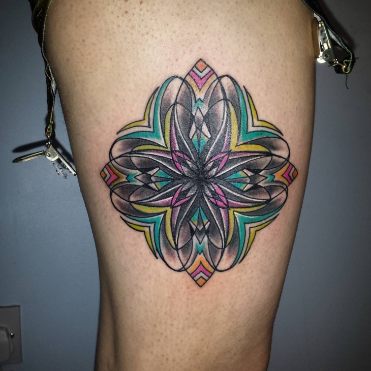 psychedelic tattoo for thigh