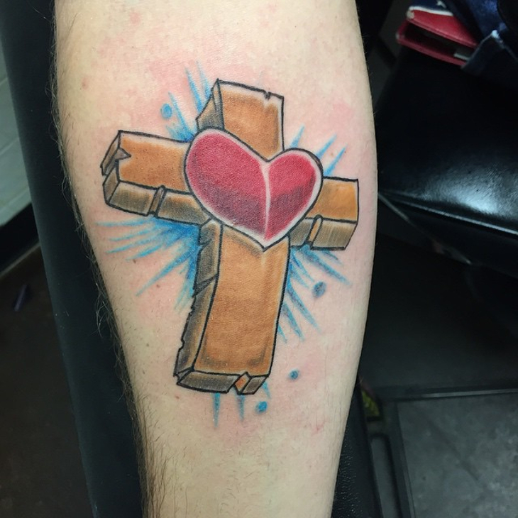 wooden cross with heart tattoo