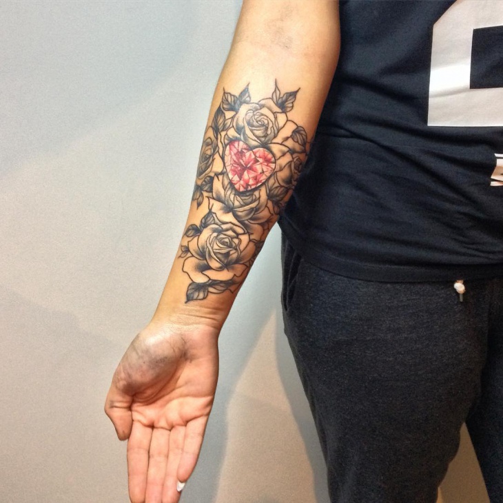 forearm cross sleeve tattoo