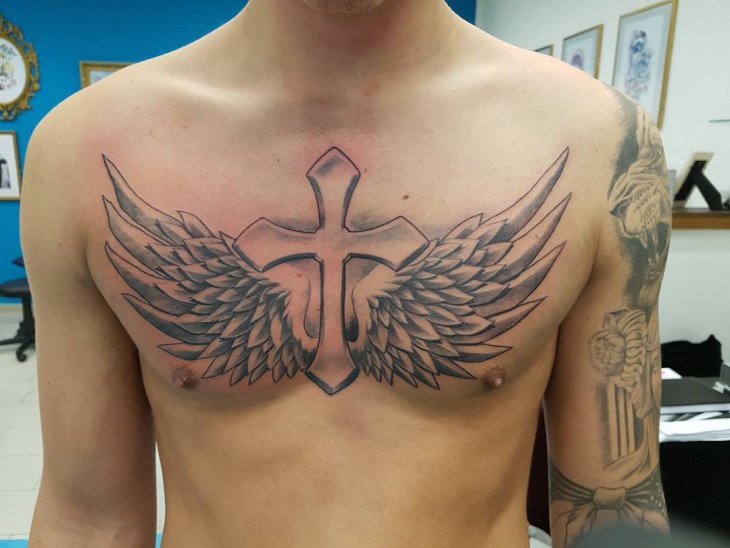 cross with wings sleeve tattoo