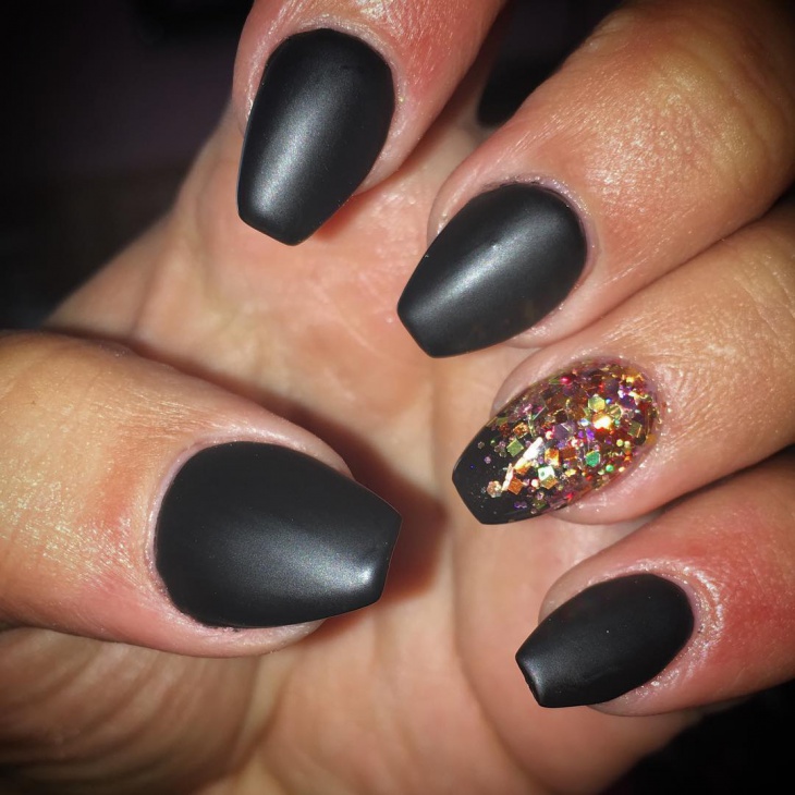 matte black and glitter stiletto nails