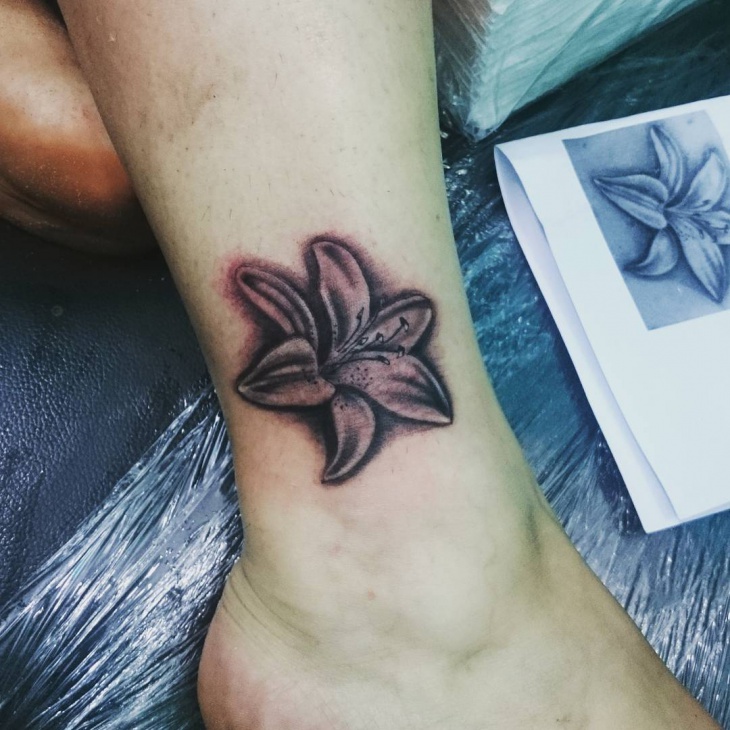 small lily flower tattoo design