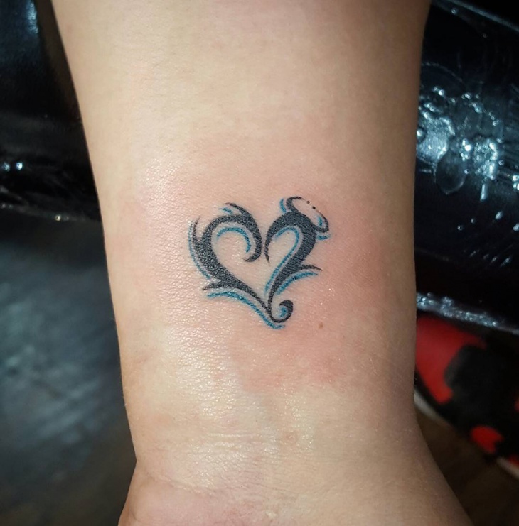 small heart tattoo on foot