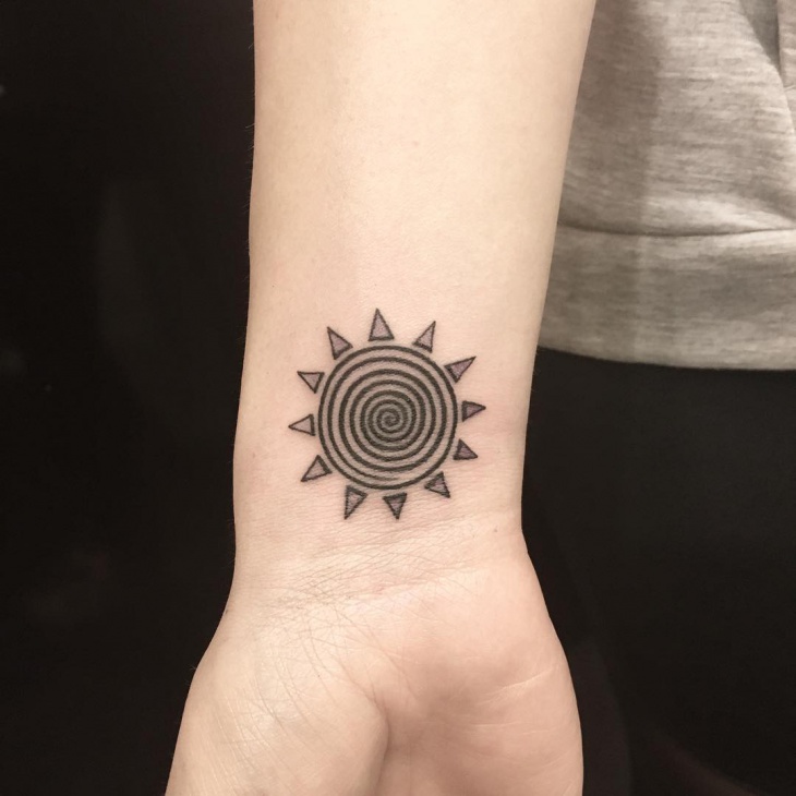 small tribal sun tattoo