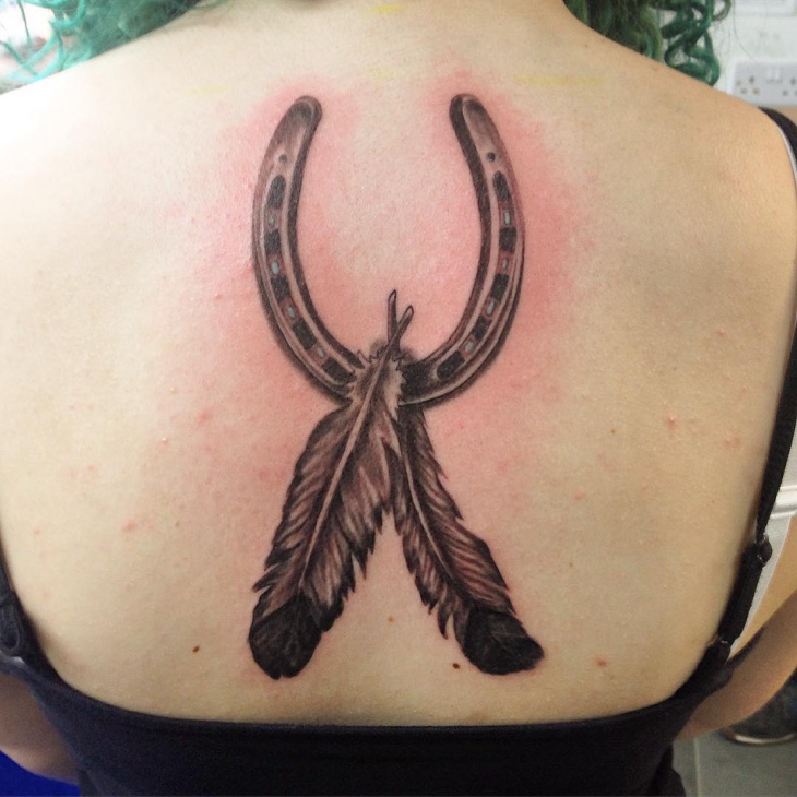 black horseshoe tattoo for back