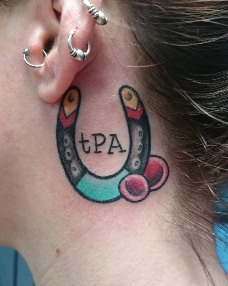 trendy horseshoe tattoo for back ear