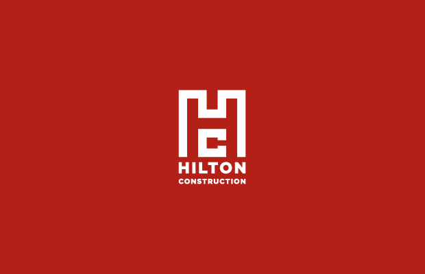 hilton construction logo design