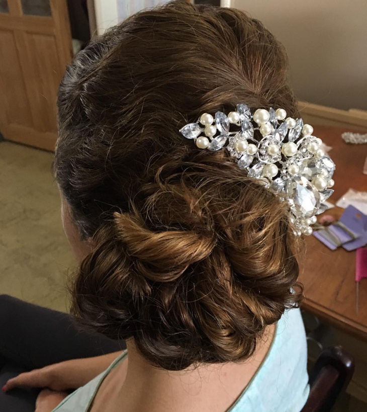 curly side bun prom hairstyle