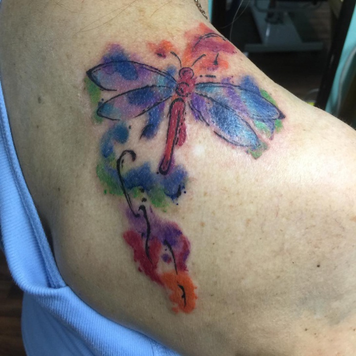 watercolor dragonfly tattoo on shoulder