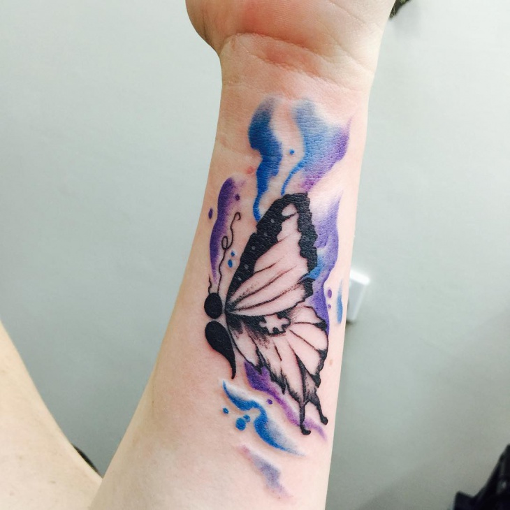 semicolon butterfly tattoo on wrist