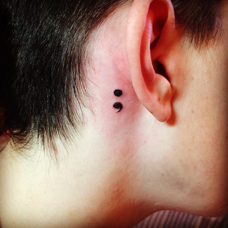 semicolon tattoo on back ear