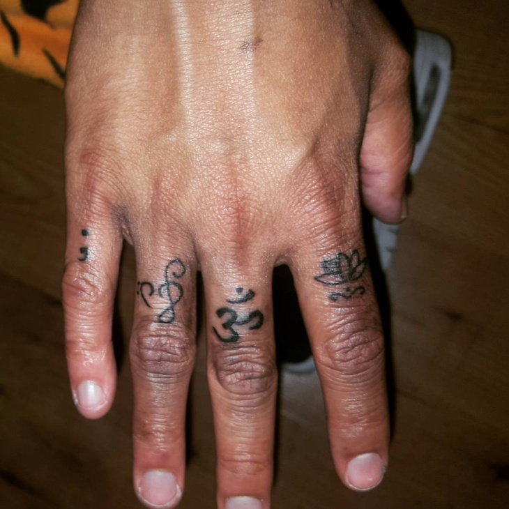 music semicolon finger tattoo