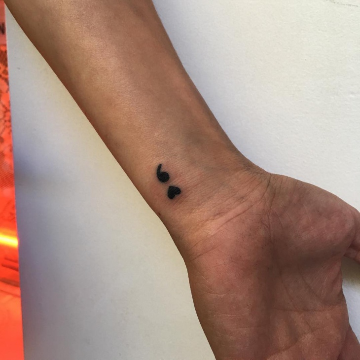 love semicolon tattoo on wrist