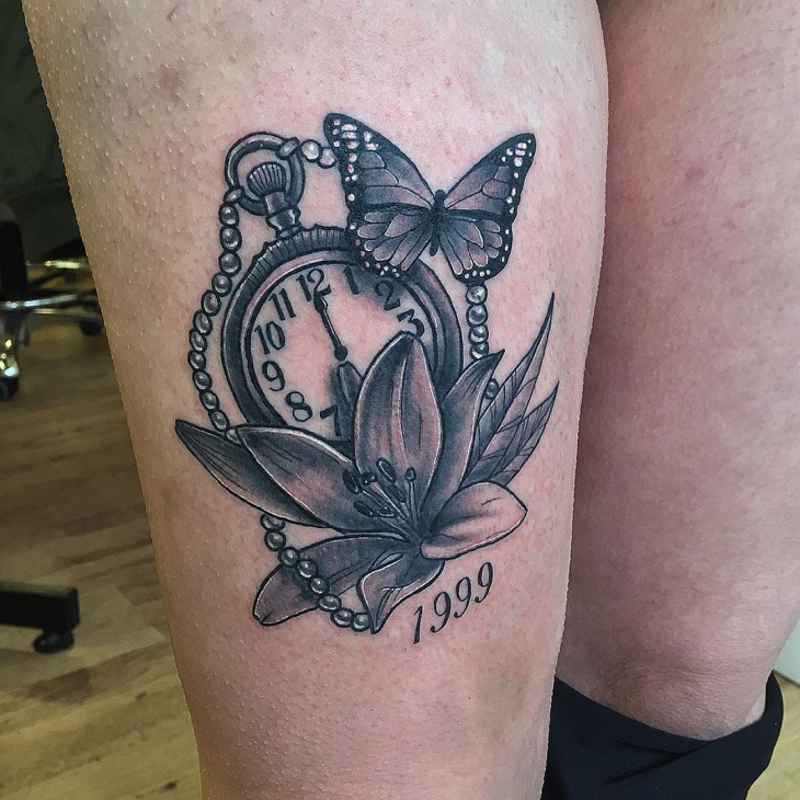 black butterfly leg tattoo