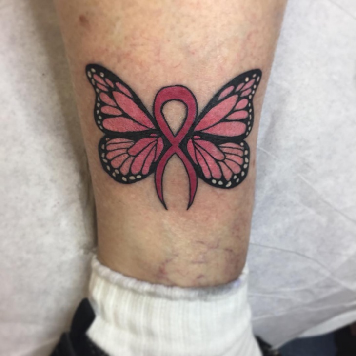 pink butterfly leg tattoo