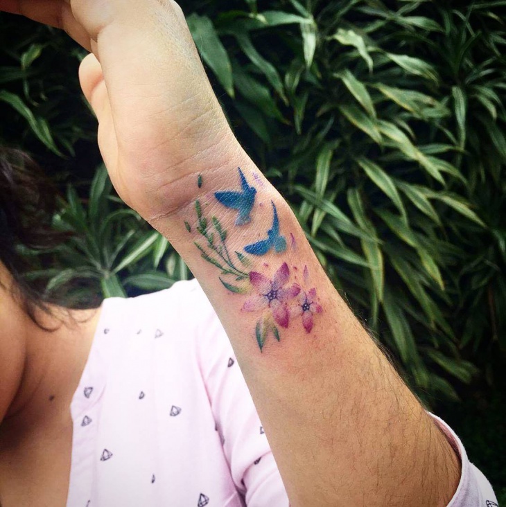 small bird wrist tattoo for women