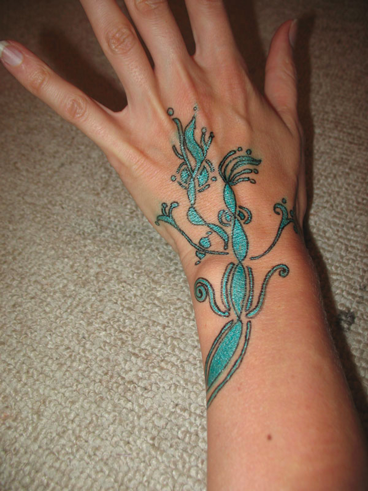 flower vine wrist tattoo
