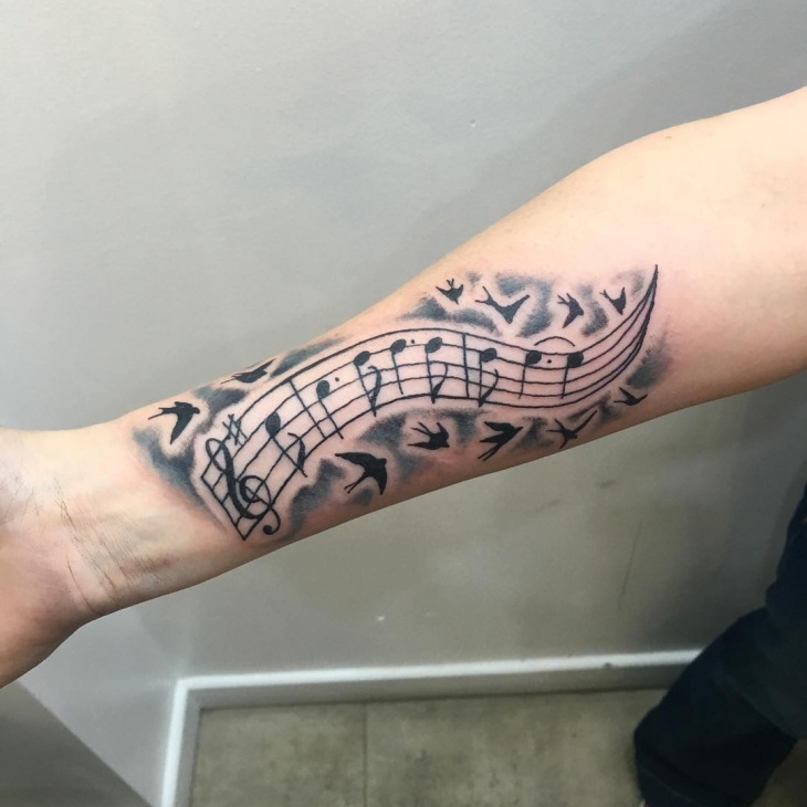music note wrist tattoo design