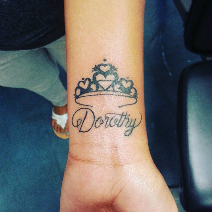 princess crown tattoo on wrist