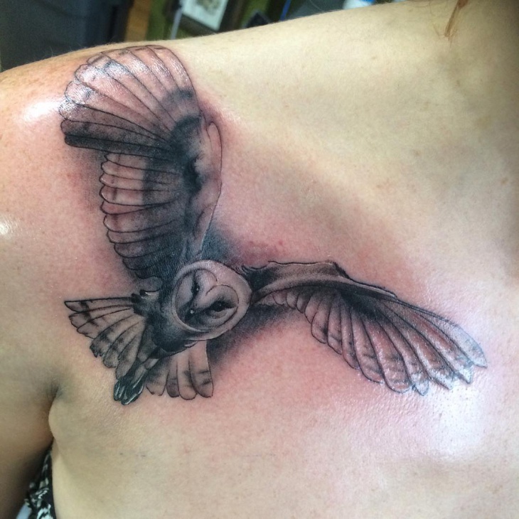 flying barn owl tattoo