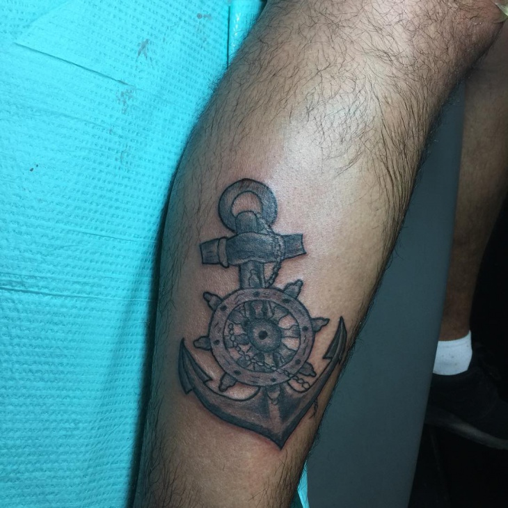 anchor and wheel tattoo on leg