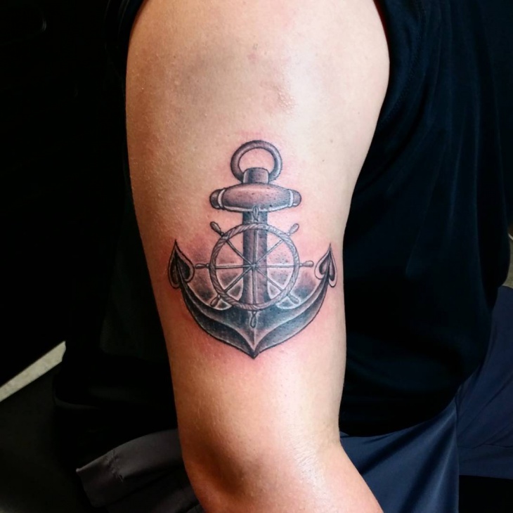 anchor wheel tattoo on sleeve