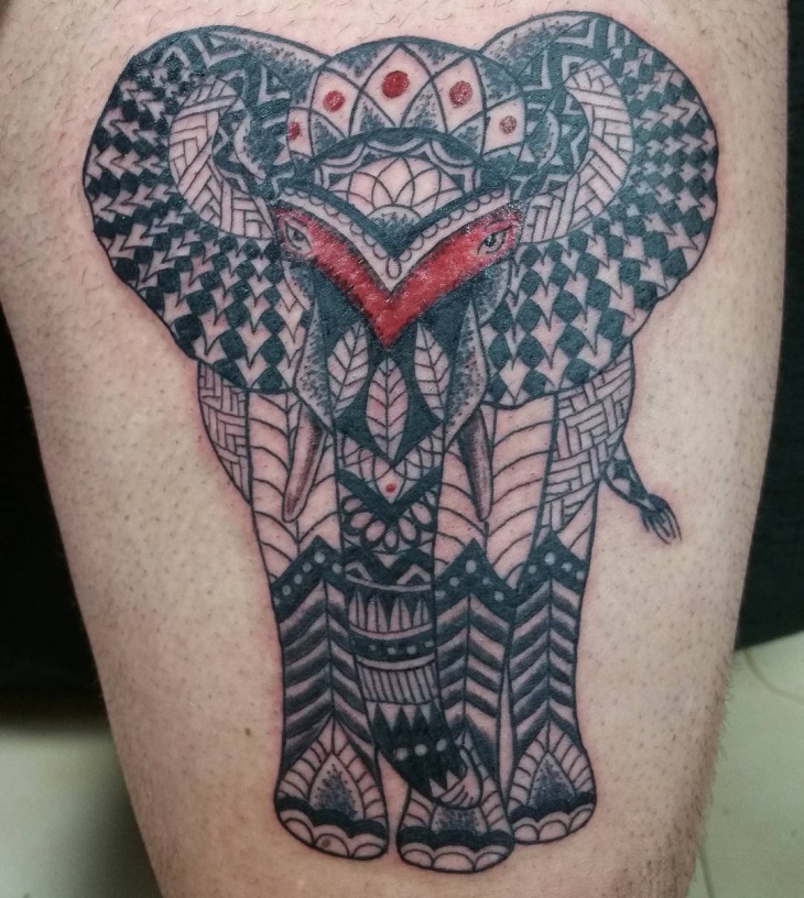 tribal elephant tattoo on thigh