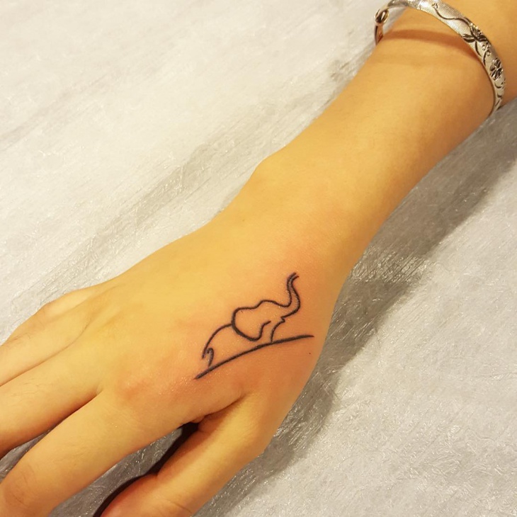 elephant hand tattoo for girls