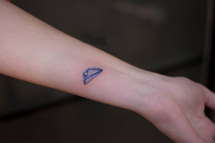 small forearm rocket tattoo