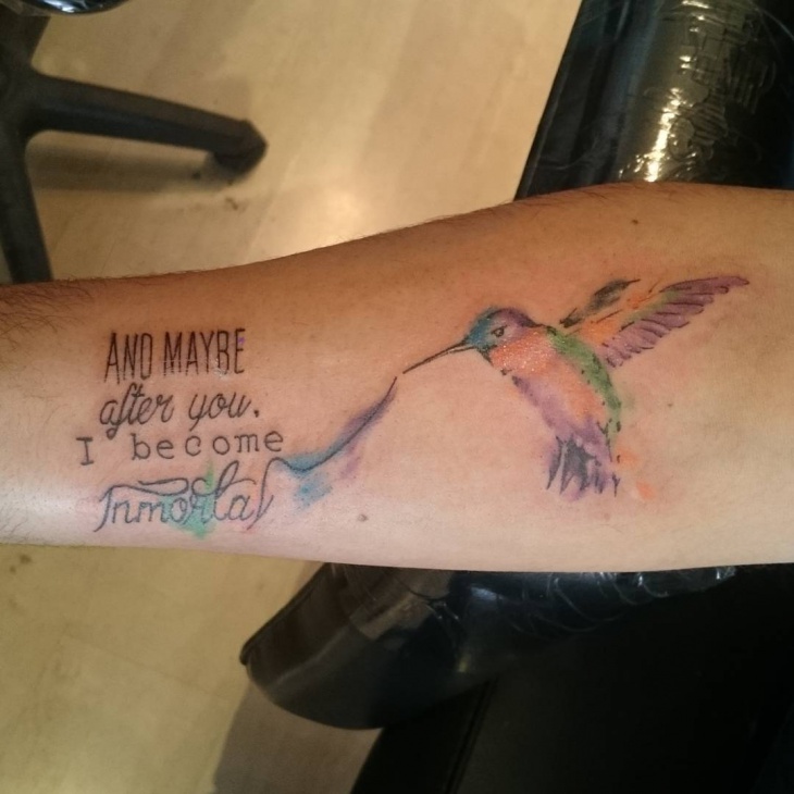 forearm bird with word tattoo