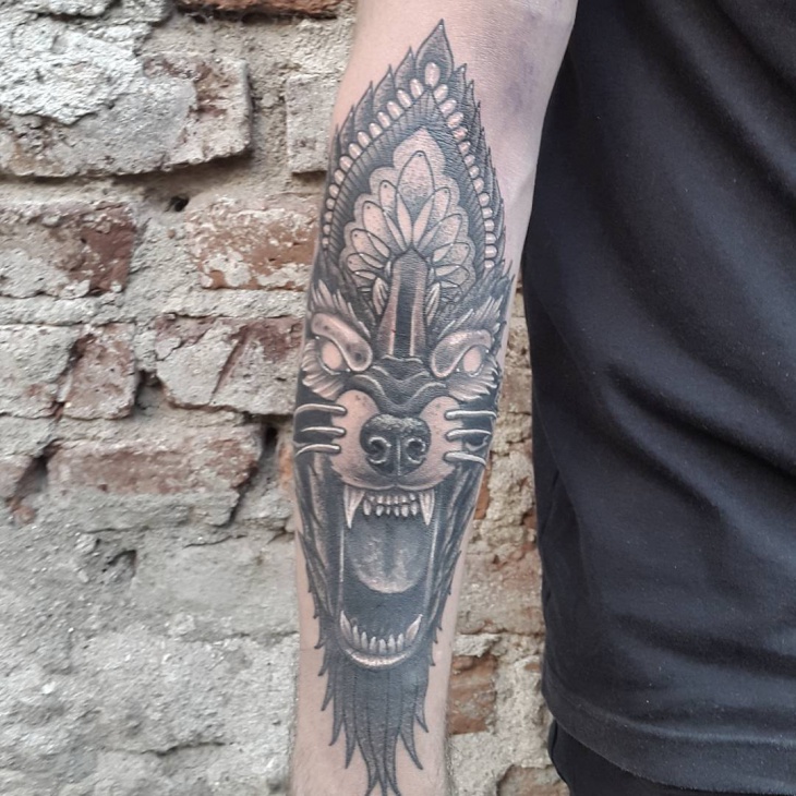 wolf face forearm tattoo