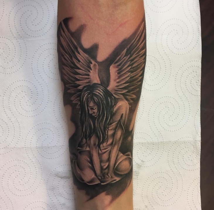 men angel forearm tattoo