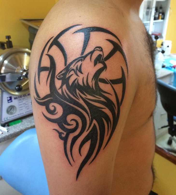 tribal wolf tattoo on sleeve