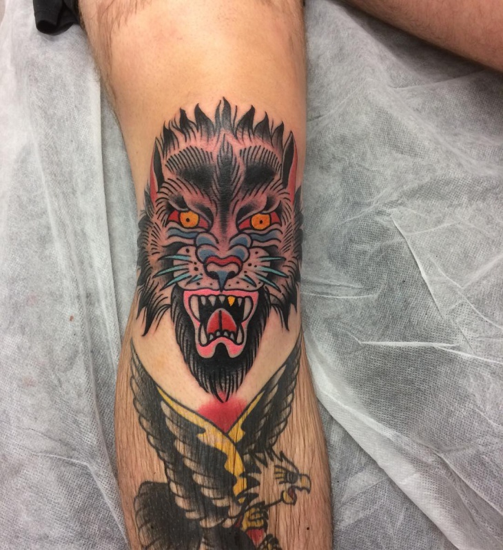 traditional wolf face tattoo idea
