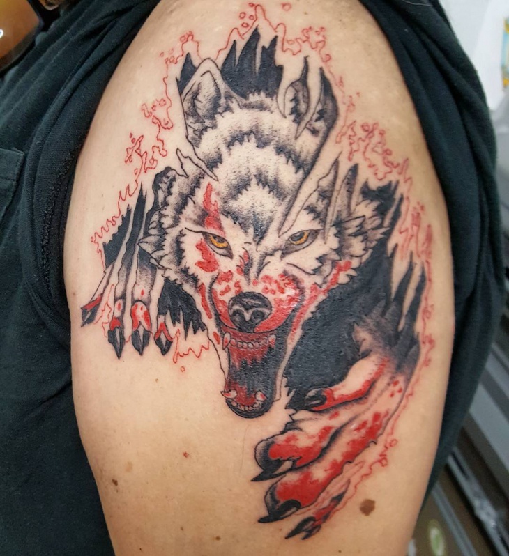 angry wolf torn skin tattoo