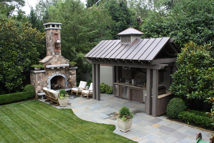 outdoor kitchen stone fireplace