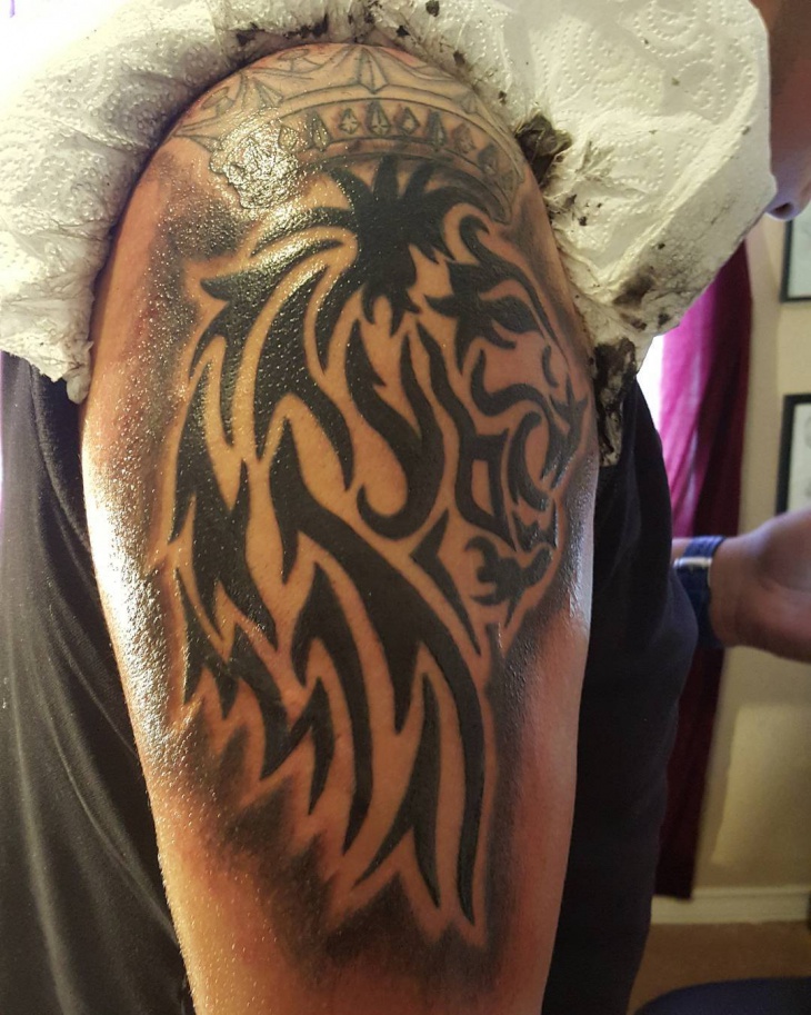 lion tribal arm tattoo