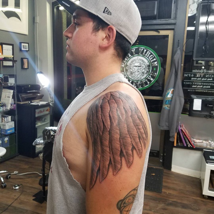 bird wings tattoo on arm