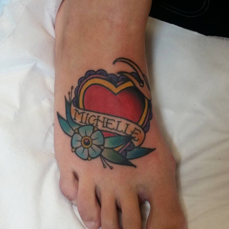 heart with flower tattoo on foot