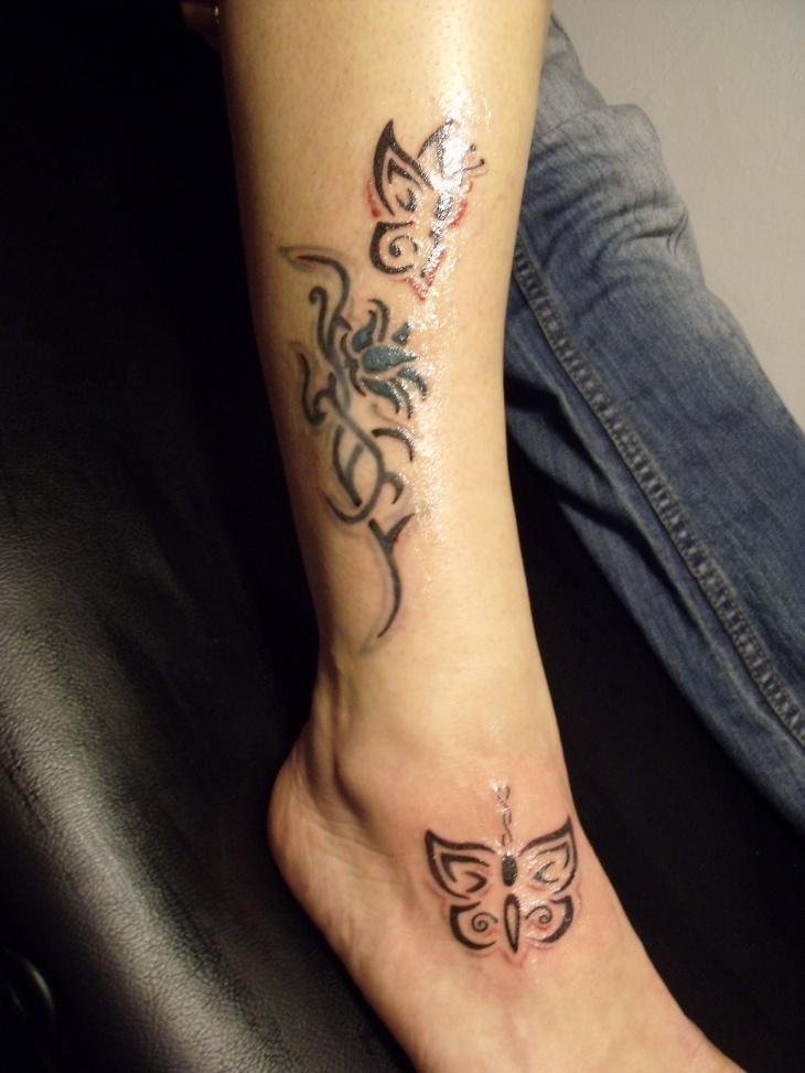 tribal butterfly tattoo on foot