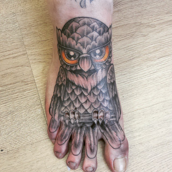 geometric owl tattoo on foot