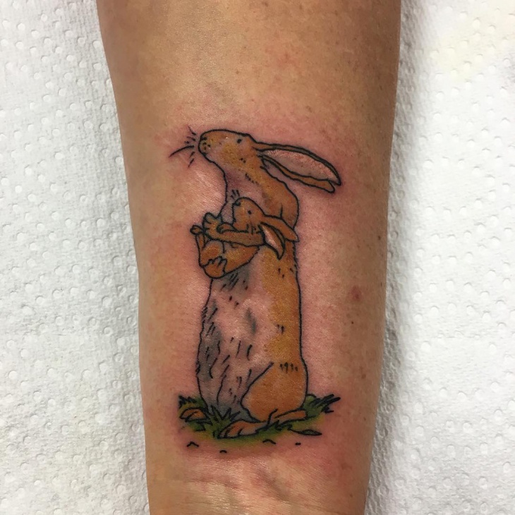 brown rabbit tattoo on hand